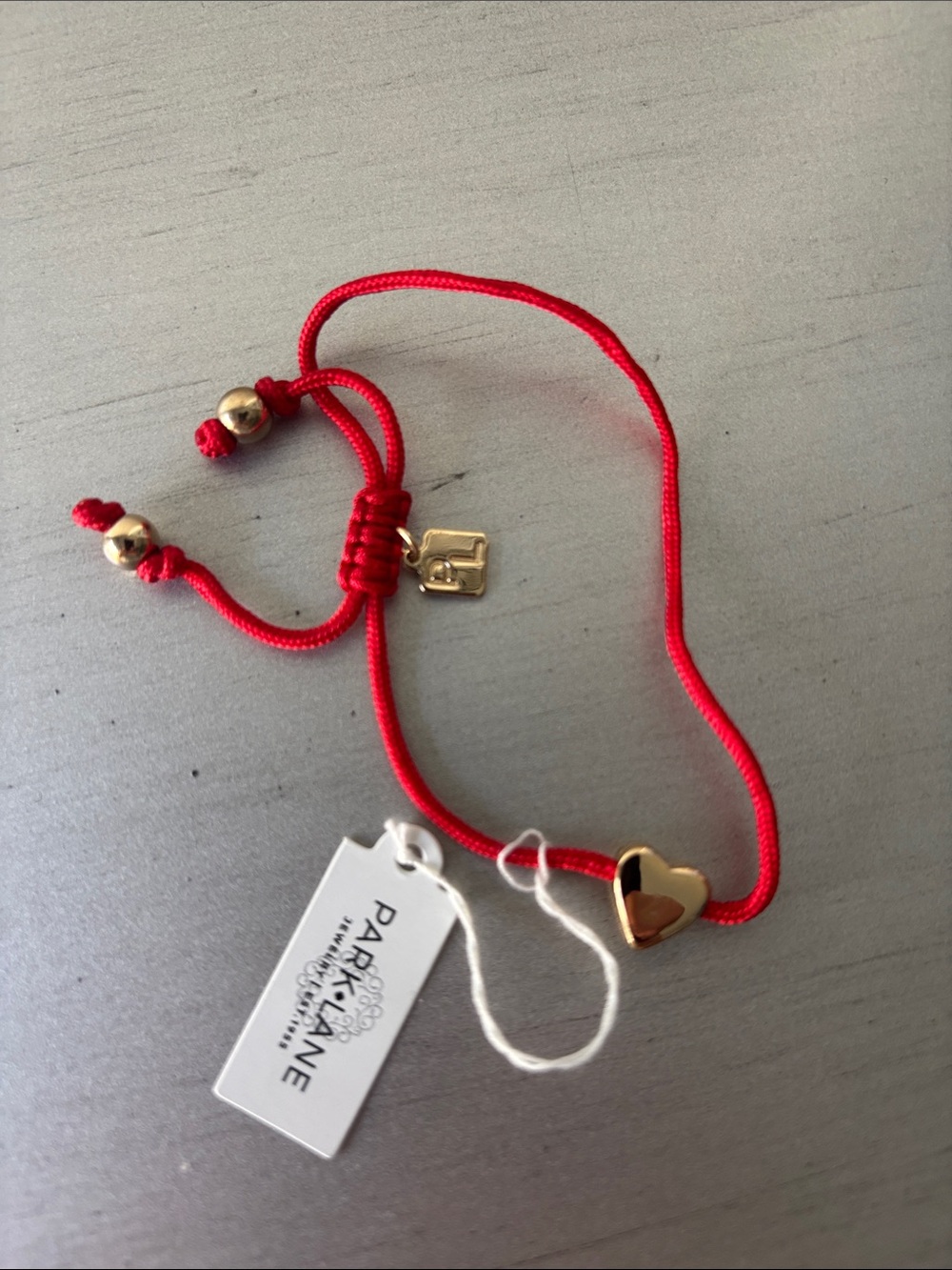 Park Lane • Red adjustable cord bracelet with heart charm